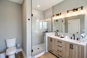 a bathroom with a toilet and a sink and a shower at 6 Mi to Chattanooga Home with Balcony and Dtwn Views! in Rossville +17 photos