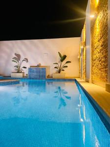 Bazén v ubytování Le Coin Paradisiaque nebo v jeho okolí