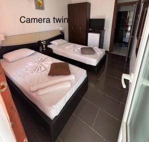 Postel nebo postele na pokoji v ubytování Complex Gec Histria Mamaia