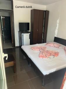 Postel nebo postele na pokoji v ubytování Complex Gec Histria Mamaia
