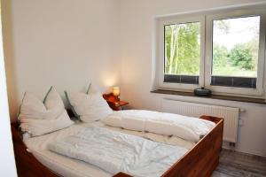 Ein Bett oder Betten in einem Zimmer der Unterkunft Haus Storjohann Dagebüll