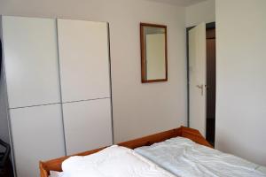 Ein Bett oder Betten in einem Zimmer der Unterkunft Haus Storjohann Dagebüll