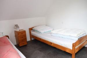 Ein Bett oder Betten in einem Zimmer der Unterkunft Haus Storjohann Dagebüll