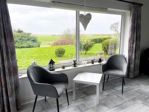 Ein Garten an der Unterkunft Haus Storjohann Dagebüll
