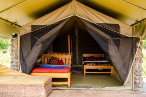 Postel nebo postele na pokoji v ubytování Leruk Maasai Mara Camp