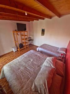 Cama ou camas em um quarto em Hostal Perita