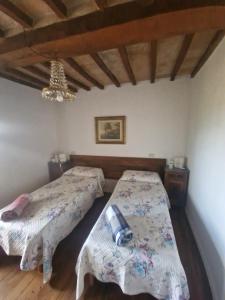 En eller flere senge i et værelse på La Locanda di Morre