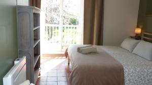 Posteľ alebo postele v izbe v ubytovaní Maison d'hôtes KerCalow, Chambres d'hôtes