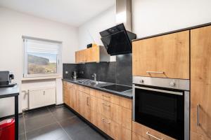 Kuchyň nebo kuchyňský kout v ubytování Ferienwohnung Wilde7