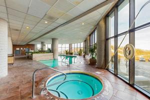 an indoor pool with a hot tub in a building at Grandfather View in Sugar Mountain