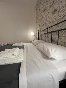 Posteľ alebo postele v izbe v ubytovaní B&B Madam Treviso