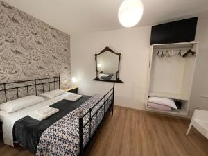 Posteľ alebo postele v izbe v ubytovaní B&B Madam Treviso