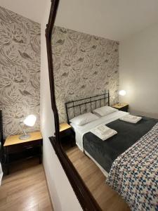 Posteľ alebo postele v izbe v ubytovaní B&B Madam Treviso