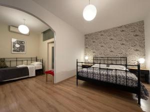 Posteľ alebo postele v izbe v ubytovaní B&B Madam Treviso