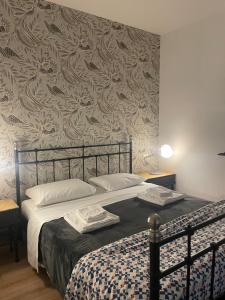 Posteľ alebo postele v izbe v ubytovaní B&B Madam Treviso