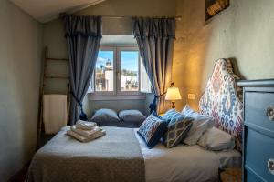 Posteľ alebo postele v izbe v ubytovaní Ronda Romántica Lofts