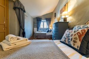 Posteľ alebo postele v izbe v ubytovaní Ronda Romántica Lofts