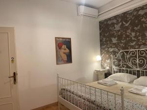 Posteľ alebo postele v izbe v ubytovaní B&B Madam Treviso