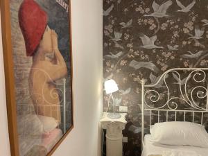 Posteľ alebo postele v izbe v ubytovaní B&B Madam Treviso