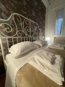 Posteľ alebo postele v izbe v ubytovaní B&B Madam Treviso