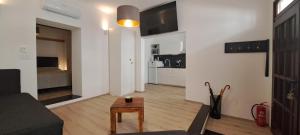 a living room with a couch and a table at Tomcat in Zagreb