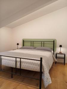 Ένα ή περισσότερα κρεβάτια σε δωμάτιο στο l'appartamentino in centro storico