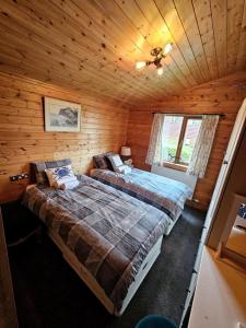 Postel nebo postele na pokoji v ubytování 3 Bedroom Ocean View Lodge