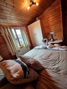 Voodi või voodid majutusasutuse 3 Bedroom Ocean View Lodge toas