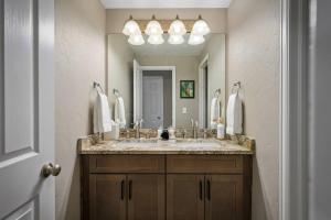 a bathroom with a sink and a large mirror at Timber Court in Granby +42 photos