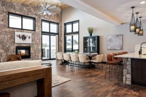 a kitchen and living room with a stone wall at Lone Eagle 765 in Granby