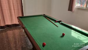 a pool table with balls on it in a room at Jade in Assinie