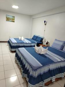Ένα ή περισσότερα κρεβάτια σε δωμάτιο στο Chelita House