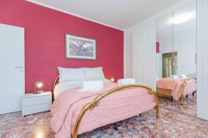 A bed or beds in a room at Appartamento Milly