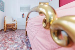 A bed or beds in a room at Appartamento Milly