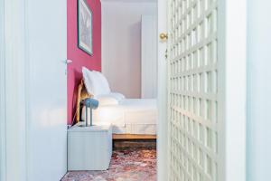 A bed or beds in a room at Appartamento Milly