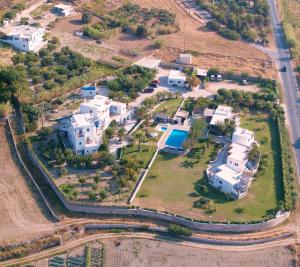 an aerial view of a house with a yard at Fragoulis Village in Parasporos +150 photos
