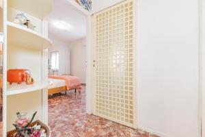 A bed or beds in a room at Appartamento Milly