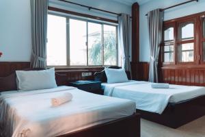 Postel nebo postele na pokoji v ubytování MONY SOKSAN Residence + 37 fotografií