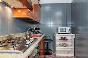 A kitchen or kitchenette at Appartamento Milly