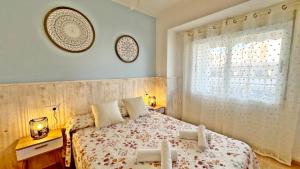 a bedroom with a bed and a window at BONAIRE CELESTE 11 - Frente a la playa - Solo Familias in Los Mártires +156 photos