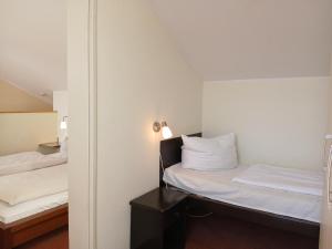 Un pat sau paturi într-o cameră la Schneeeule 219 +13 fotografii