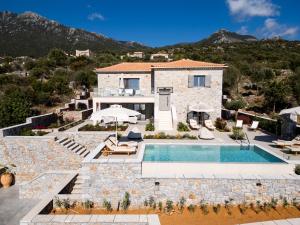 an image of a villa with a swimming pool at Olive & Stone Residences in Neokhórion