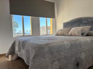 Ένα ή περισσότερα κρεβάτια σε δωμάτιο στο Apartamento Lilo