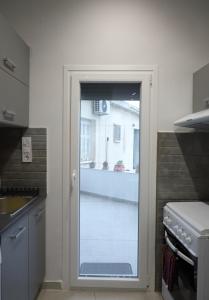 Kuchyň nebo kuchyňský kout v ubytování Ariadni Apartment Cozy Escape