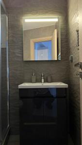 Koupelna v ubytování Ariadni Apartment Cozy Escape + 17 fotografií