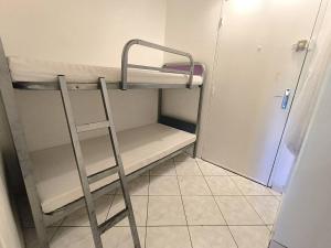 Poschodová posteľ alebo postele v izbe v ubytovaní 193 Hameau C005