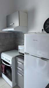 Kuchyň nebo kuchyňský kout v ubytování Ariadni Apartment Cozy Escape