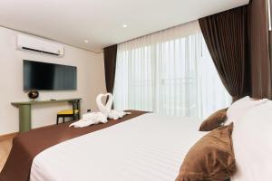 Postel nebo postele na pokoji v ubytování Shine Aparthotels Sukhumvit Thonglor