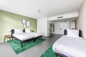 Postel nebo postele na pokoji v ubytování Gooiland Hotel