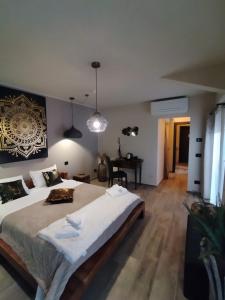 a bedroom with a large bed and a desk at La Signoria Relais in Ferrara +55 photos